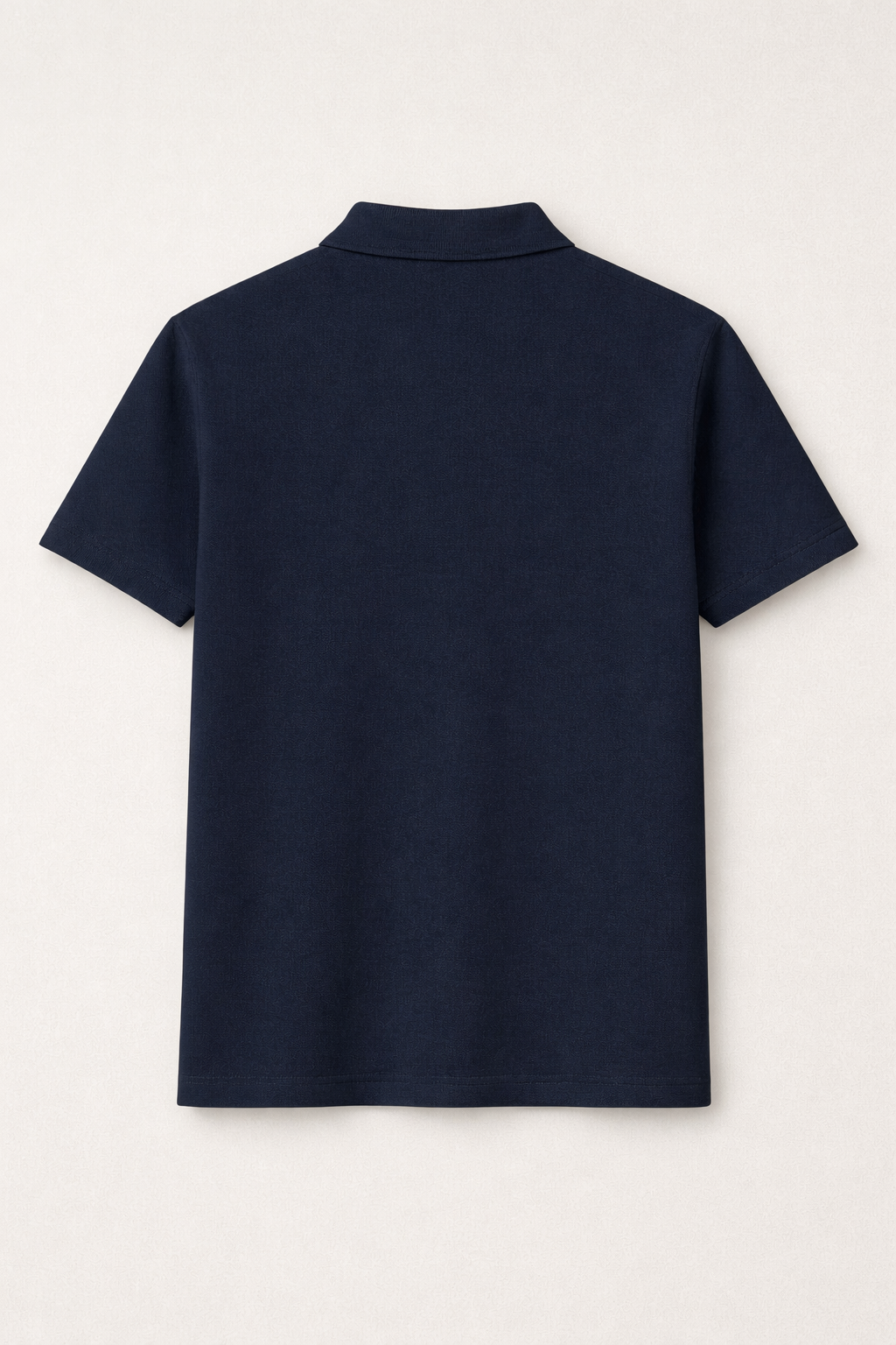 Navy blue polo shirt on a light gray background