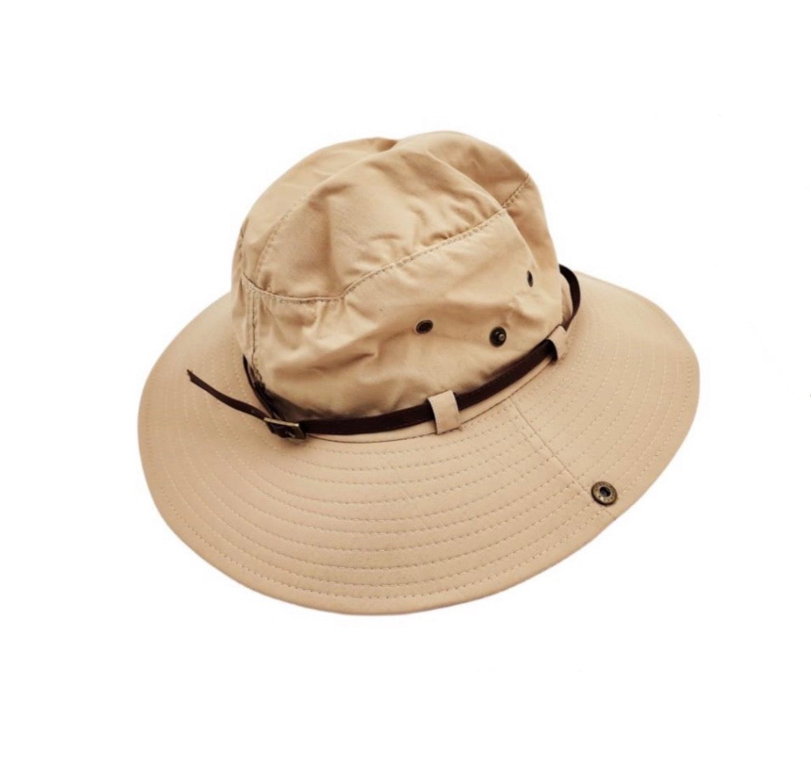 Beige bucket hat with a black band on a white background