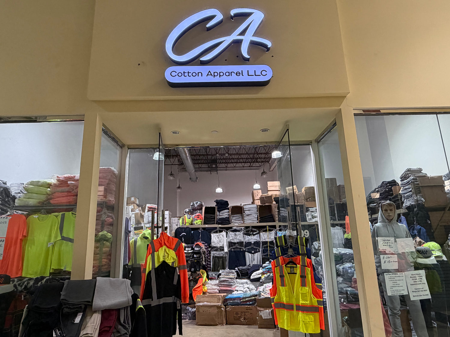 Storefront of Cotton Apparel LLC with wholesale clothing on display