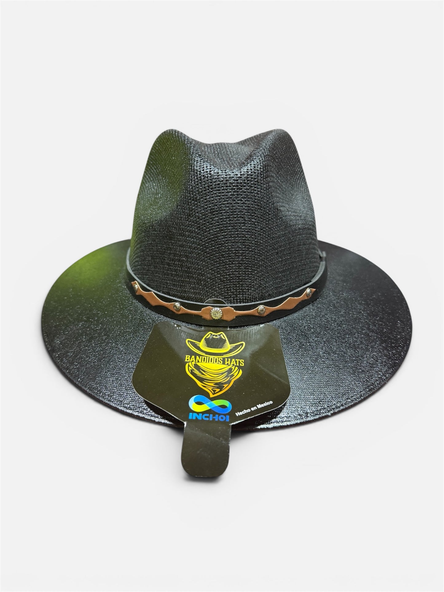Black straw hat with decorative band on a white background