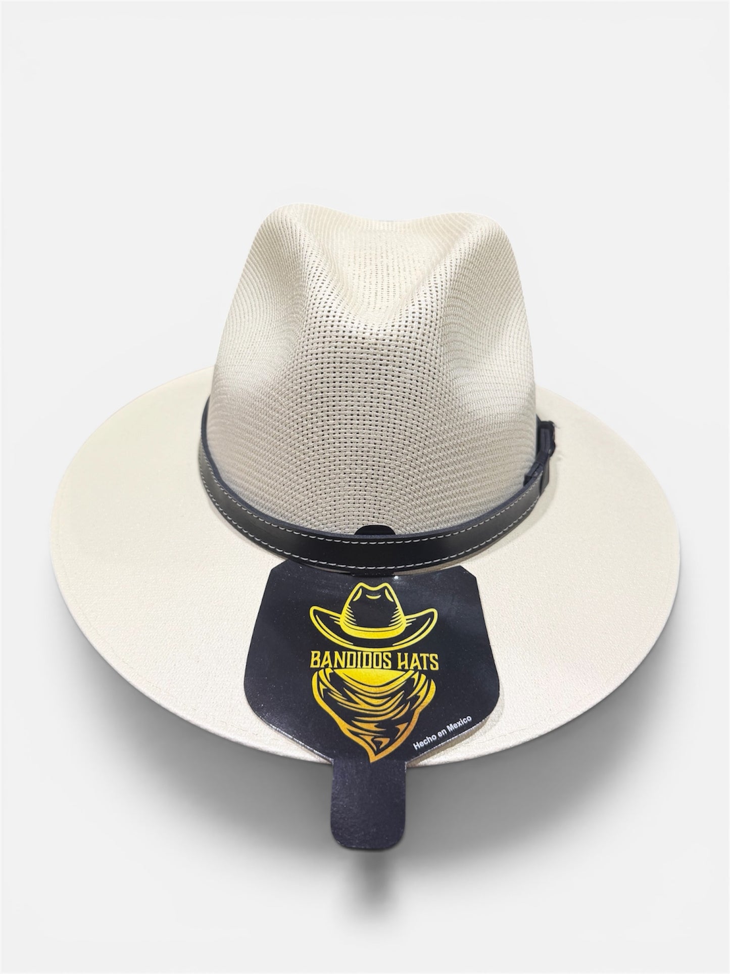 White straw hat with black band and 'Bandidos Hats' logo on a white background