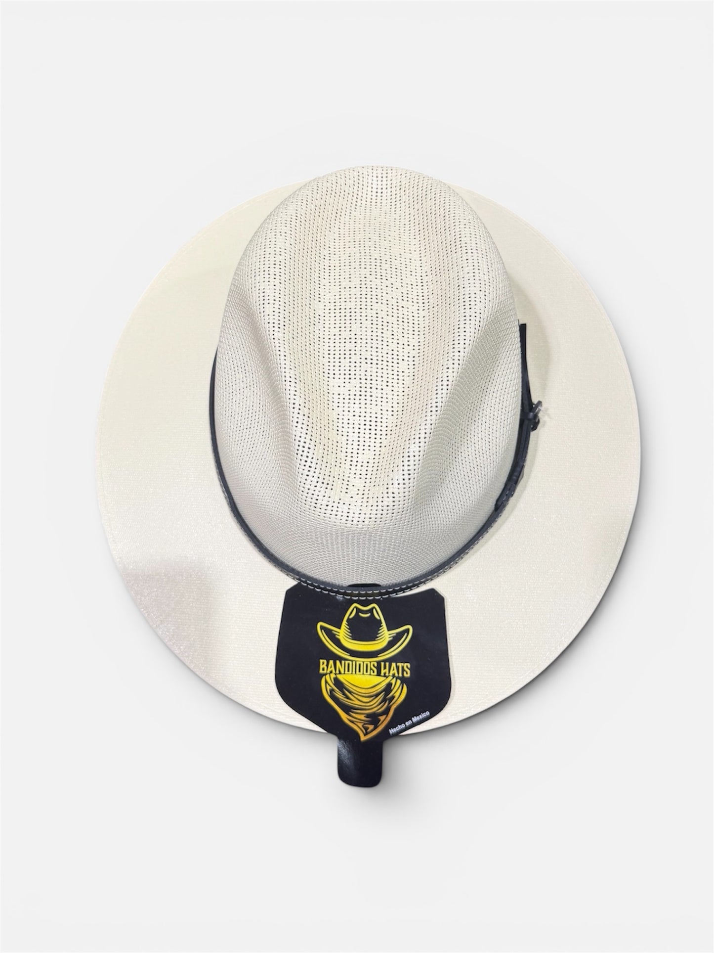 White straw hat with a black band featuring a logo on a white background