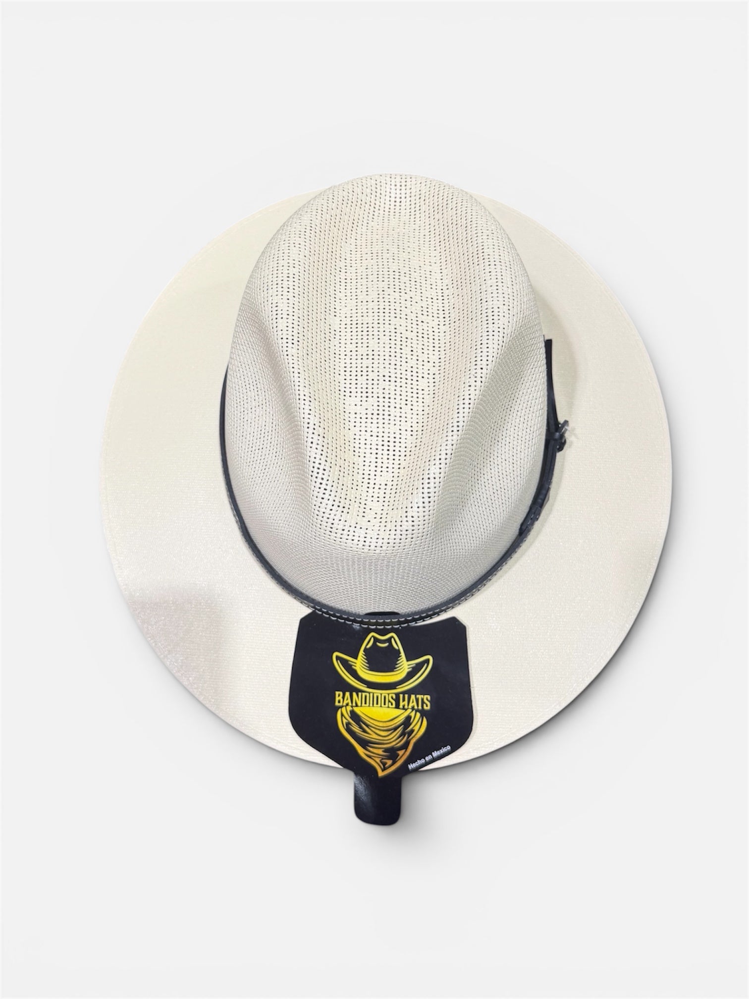 White straw hat with a black band featuring a logo on a white background