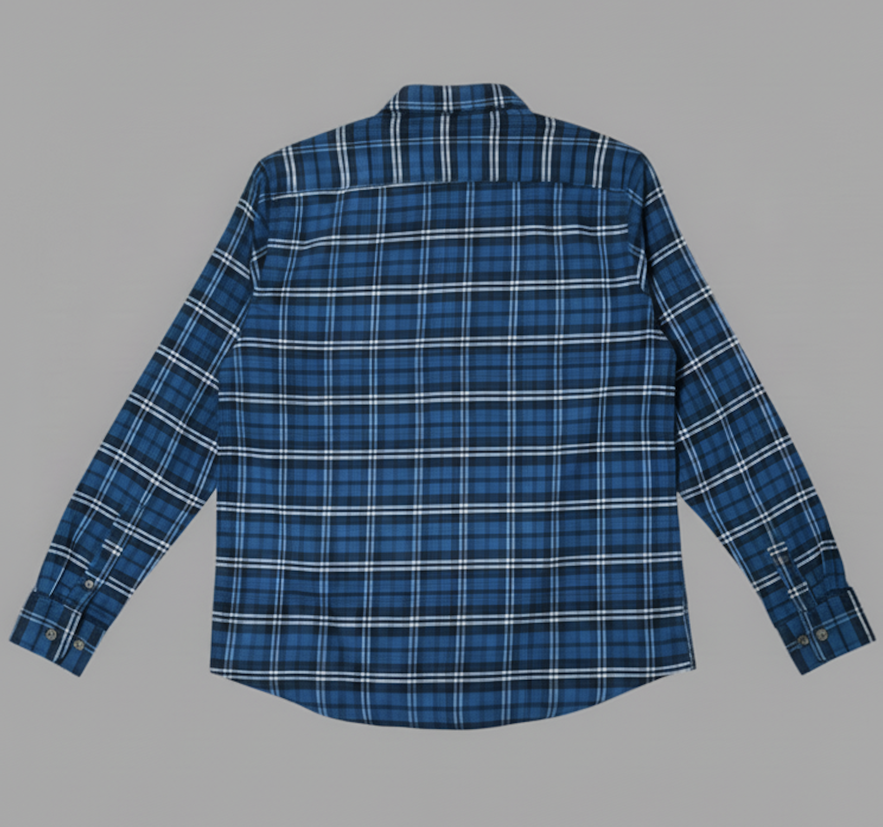 Blue plaid flannel shirt on a gray background