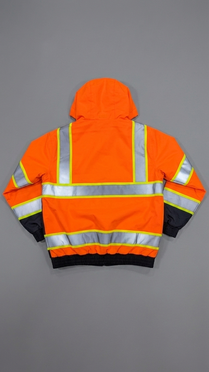 Orange safety jacket with reflective stripes on a gray background